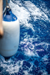 Close-Up Fender View on Sailboat with Ocean Waves