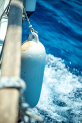 Close-Up Fender View on Sailboat with Ocean Waves