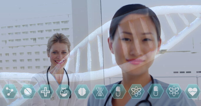 Medical professionals with stethoscopes smiling, DNA helix and health icons overlay - Powered by Adobe