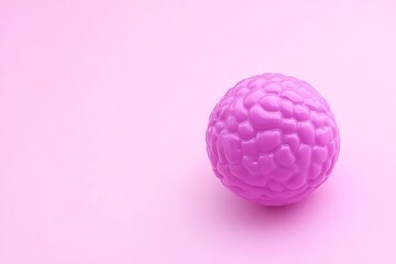 Pink brain model on a pink background, symbol of thought process