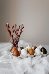 Easter aesthetics, minimalistic background, glazed pastries, candles in the form of Easter eggs,...