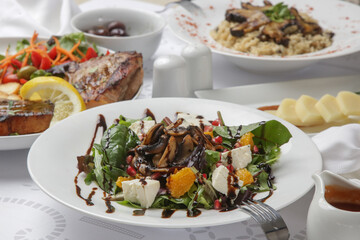 Various Mediterranean dishes served on the restaurant table	
