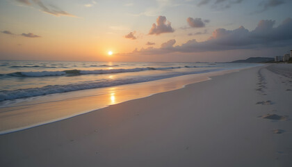 Obraz premium Serene sunrise beach scene with footprints in the sand evokes tranquility and peaceful solitude of tropical vacation