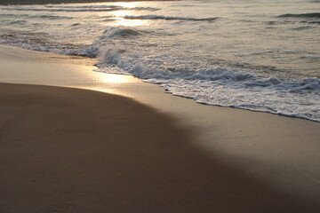 Sunset on the beach by the sea in the evening, coastal landscape, calm lifestyle, walking outdoors, shore nature scenery, soft sun light, adventurous vacation holiday idea, wallpaper, outside trees