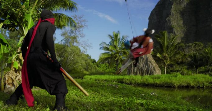 Woman doing awesome backwards stunt on wires as she fights ninja, wide shot