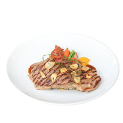 Close-up of grilled chicken breast with vegetables in indoor restaurant setting