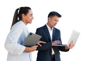 Professionals discussing project details outdoors while using digital devices in a collaborative setting