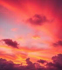 Fototapeta premium Fiery orange and pink hues, soft clouds brushed across a vibrant twilight sky, majestic, sunset