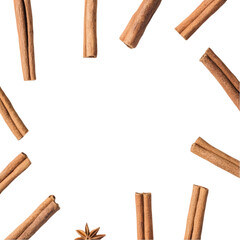 Circular Arrangement of Cinnamon Sticks and Star Anise on White Background
