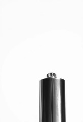 Close-up of a shiny metal whistle against a pure white background, security, isolated object