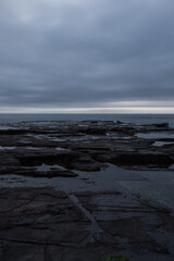 Fototapeta premium Rock formation and cloudy sky.