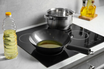 Frying pan with cooking oil in kitchen