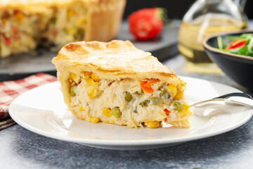 Piece of delicious fresh homemade pie served on gray textured table, closeup