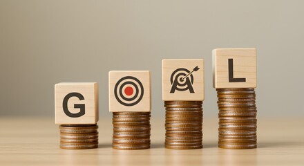 Wooden blocks spelling "GOAL" rest on stacks of coins, with a target icon representing financial planning, savings, Financial Goals and Savings Concept. achieving monetary objectives, business growth,