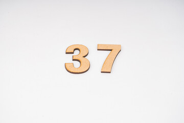 Number thirty-seven on paper on a white background.