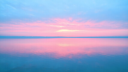 soft pastel blue sky with pink and orange hues blending at sunrise