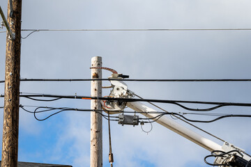 Utility digger derrick truck with pole setting equipment, ready to remove temporary wood powerline...