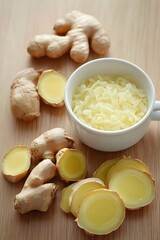 Fresh Ginger Root Slices and Grated Ginger in Bowl