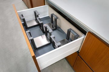 Modern kitchen drawer organization with segmented compartments for optimal storage and easy access