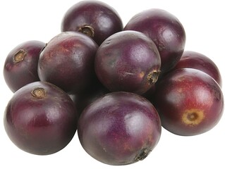 Fototapeta premium A pile of ripe purple fruit on a white background