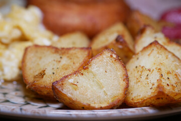 Delicious crispy roasted potatoes served on a decorative plate