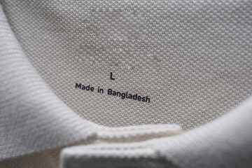 Tag showing size and origin on a garment from Bangladesh