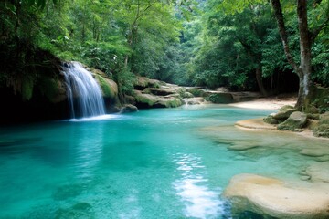 Fototapeta premium Beautiful Erawan waterfall cascading into turquoise pond in Kanchanaburi, Thailand
