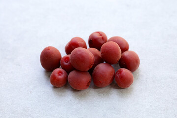 Umeboshi, Japanese pickled plums, Sour and salty taste.