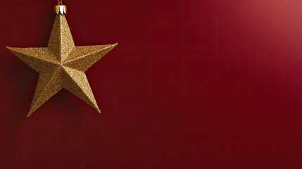 A golden Christmas star hanging from the top in the left corner. The right side features a solid rich red background for text.