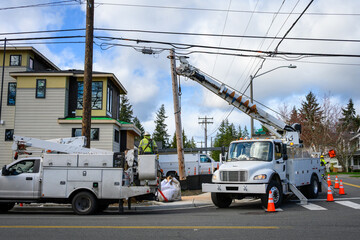 Temporary wood powerline pole cut off and being lifted out of place by utility digger derrick truck...