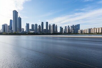 Obraz premium Vibrant Cityscape with Skyscrapers and Reflective Water Body