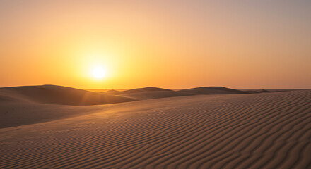 Hot yellow sand dunes meet the arid Sahara sky at sunrise and sunset