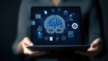 Close up view of a person holding a laptop displaying a digital brain hologram with glowing icons and connections. Dark background, selective focus