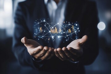 Naklejka premium Businessman holding holographic financial data.