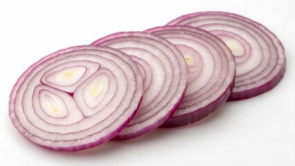 Fototapeta premium A close-up of thinly sliced red onion rings arranged neatly on a pure white background