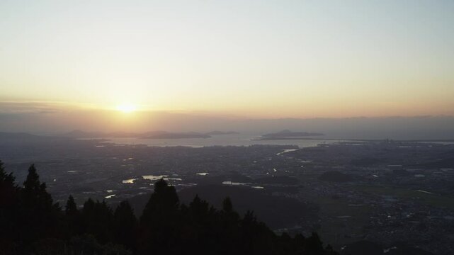 suburbs, mountain top, cityscape, sea, islands, backlight, sun, circle, evening, halation