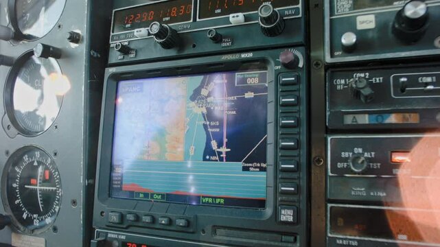  Piper PA-31 Pilot Adjusting GPS During Flight