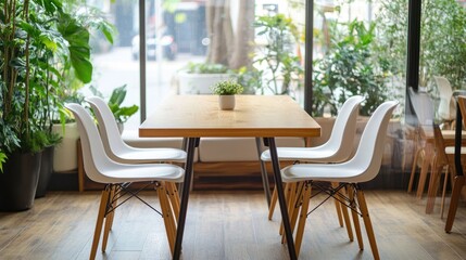 Cafe table and chairs by window, modern interior