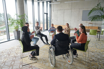 Corporate business team meeting with a manager or coach. Group of happy diverse, multiracial people...