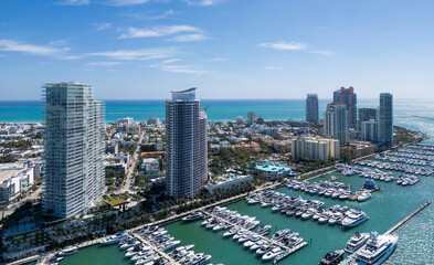 Luxury yacht cruising on Miamis coastline. Aerial view of yachts docked in Miami marina. Miami skyline yachts. Miami Beach with yacht in bay. Summer vacation in Miami. Yachts in South Pointe Marina.