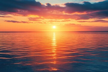 Fototapeta premium Vibrant sunset over calm ocean waters