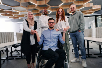 Young businessmen in a modern office extend a handshake to their business colleague in a wheelchair, showcasing inclusivity, support, and unity in the corporate environment.
