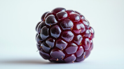 Isolated close-up of a boysenberry emphasizing its rich colors and textures.