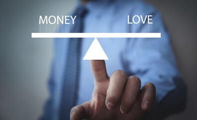 Money and Love words on scales.