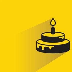 birthday cake with shadow on yellow background