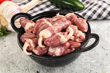 Fresh raw chicken hearts in the bowl