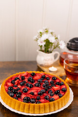 Berry pie and tea on the table. Dessert for tea. Berry pie. Strawberry pie