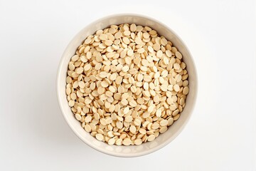 Fototapeta premium Bowl filled with dried melon seeds on a white background, showcasing their texture and natural color. Concept of healthy snacks and nutrition. Ai generative