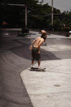Young men skateboarding in skate park, Canggu, Bali, Indonesia