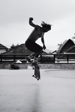 Young men skateboarding in skate park, Canggu, Bali, Indonesia